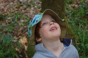 Child in the woods at Forgewood campsite